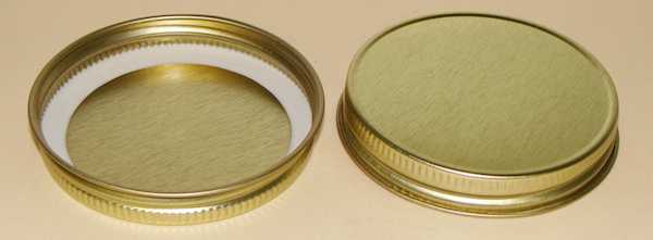 63-400 NATURAL THREADS, KNURLS, & CURL TIN-PLATE STEEL TIN-PLATE STEEL CONTINUOUS THREAD (CT) CAP WITH PLASTISOL LINER
