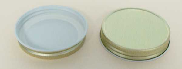 63-400 NATURAL THREADS, KNURLS, & CURL TIN-PLATE STEEL TIN-PLATE STEEL CONTINUOUS THREAD (CT) CAP WITH PLASTISOL LINER