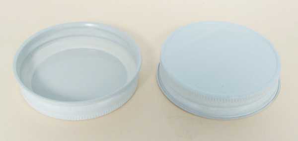 63-400 NATURAL THREADS, KNURLS, & CURL TIN-PLATE STEEL TIN-PLATE STEEL CONTINUOUS THREAD (CT) CAP WITH PLASTISOL LINER