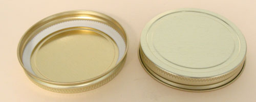 70-400 NATURAL THREADS, KNURLS, & CURL TIN-PLATE STEEL TIN-PLATE STEEL CONTINUOUS THREAD (CT) CAP WITH PLASTISOL LINER