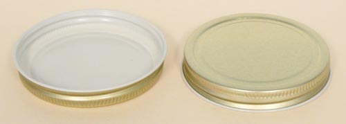 70-400 NATURAL THREADS, KNURLS, & CURL TIN-PLATE STEEL TIN-PLATE STEEL CONTINUOUS THREAD (CT) CAP WITH PLASTISOL LINER