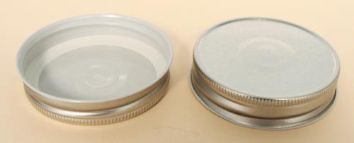 70MM SILVER/WHITE THREADS, KNURLS, & CURL TIN-PLATE STEEL METAL CONTINUOUS THREAD (CT) CAP WITH PLASTISOL LINER