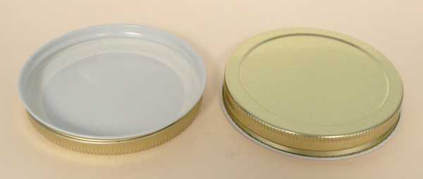 83-400 GOLD/WHITE THREADS, KNURLS, & CURL TIN-PLATE STEEL METAL CONTINUOUS THREAD (CT) CAP WITH PLASTISOL LINER