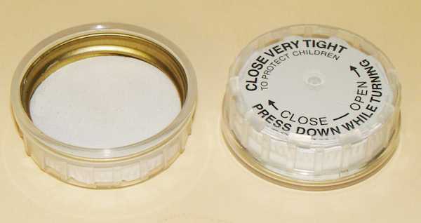 24-400 WHITE, BLACK PRINT THREADS, KNURLS, & CURL TIN-PLATE & PLASTIC CHILD RESISTANT CAP (CRC) WITH PULP POLY LINER